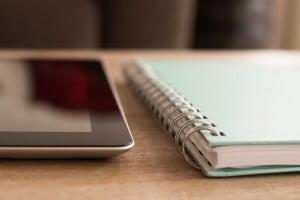Notebook and tablet on desk